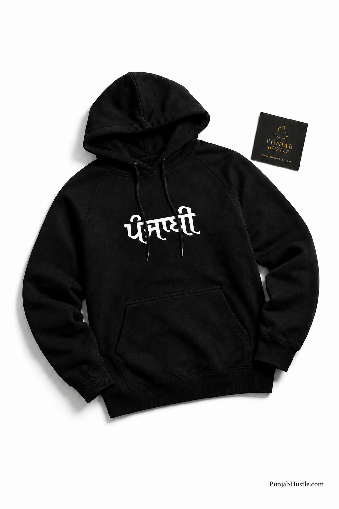 Punjab Hustle black Punjabi hoodie flat lay with white ਪੰਜਾਬੀ print and branded card on a white background.